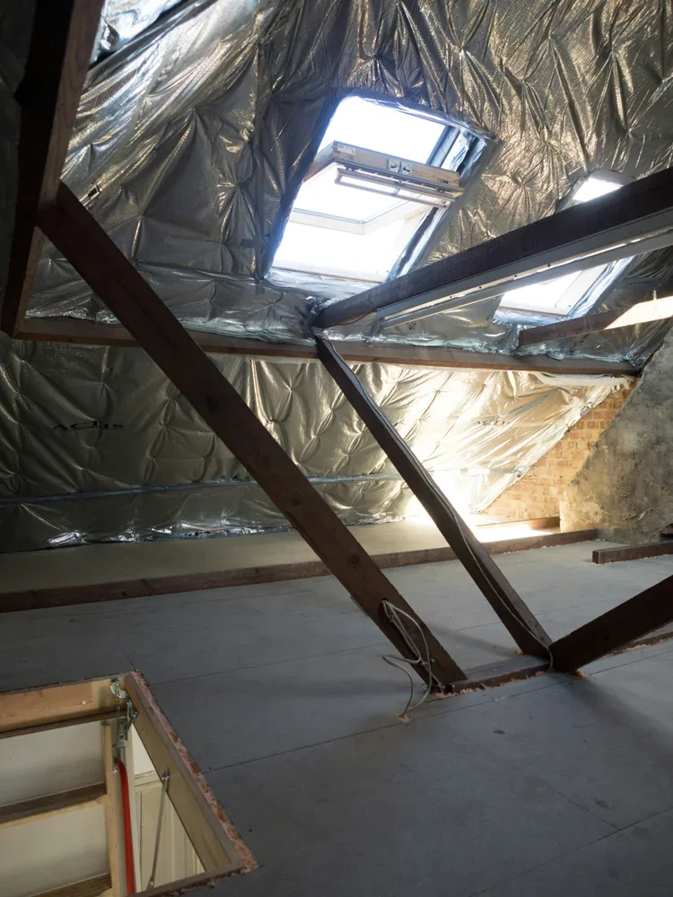 Attic insulation savings affected by continuity around skylights, hatches and roof framing