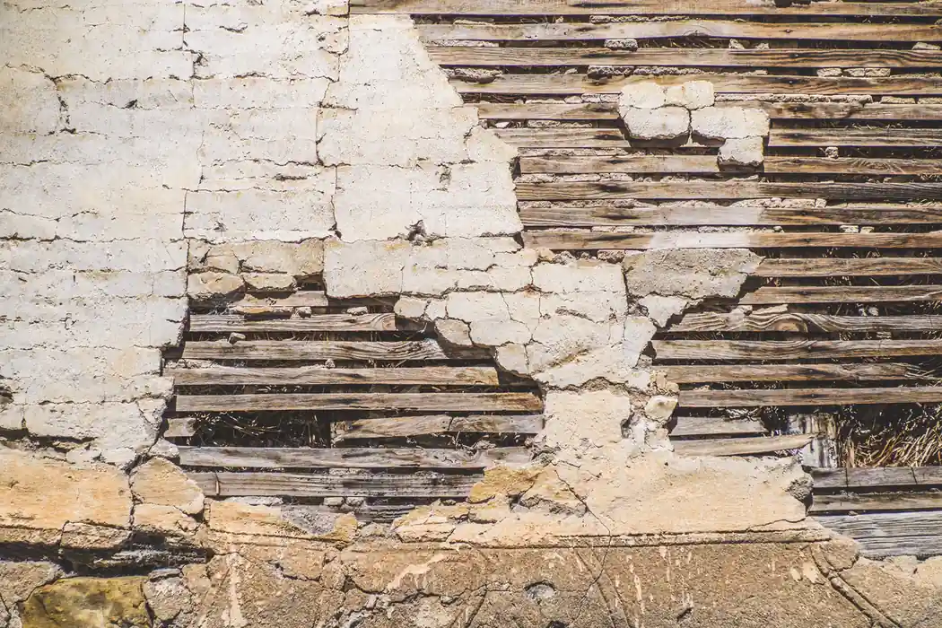 Drywall vs plaster comparison showing damaged plaster and exposed wood lath
