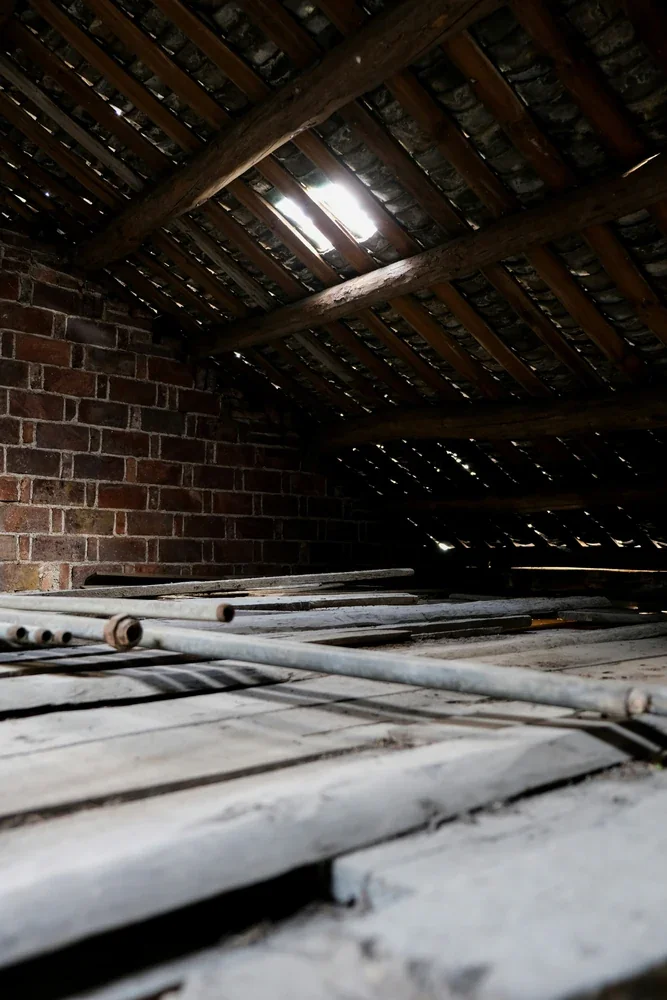 Older Montreal attic requiring moisture, ventilation and hazardous-material checks before insulation