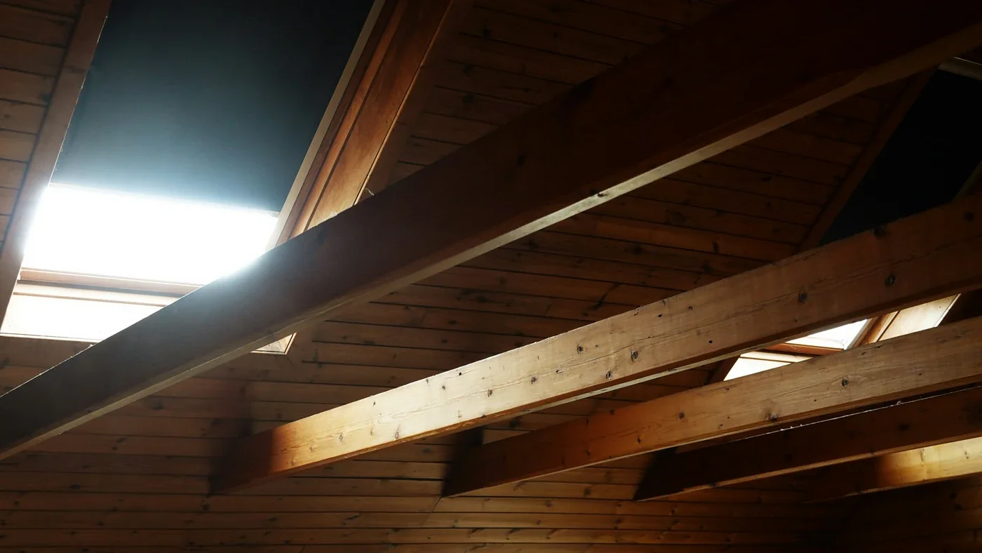 Attic roof framing showing that heat, air and moisture control affect insulation savings